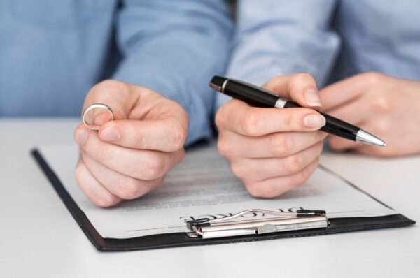 close-up-couple-signing-divorce-contract